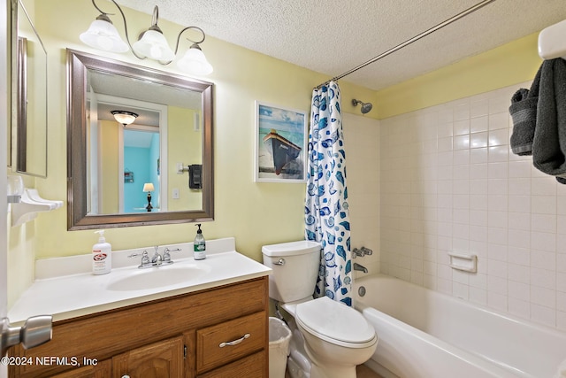 full bathroom featuring vanity, shower / bathtub combination with curtain, a textured ceiling, and toilet