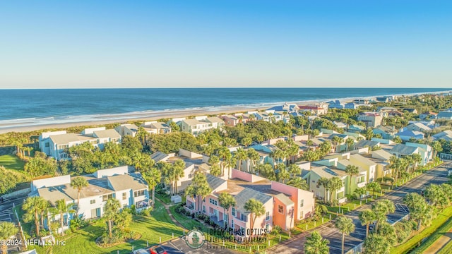 aerial view featuring a residential view, a view of the beach, and a water view