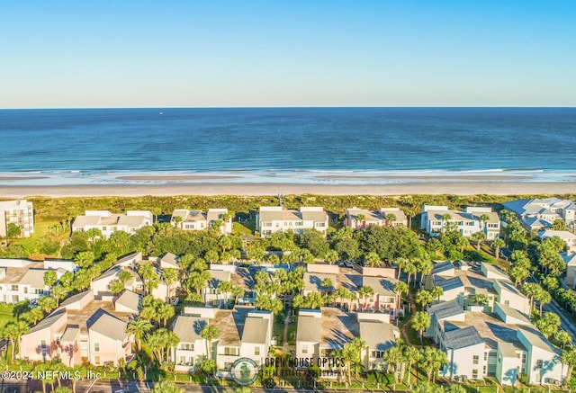 bird's eye view with a beach view and a water view