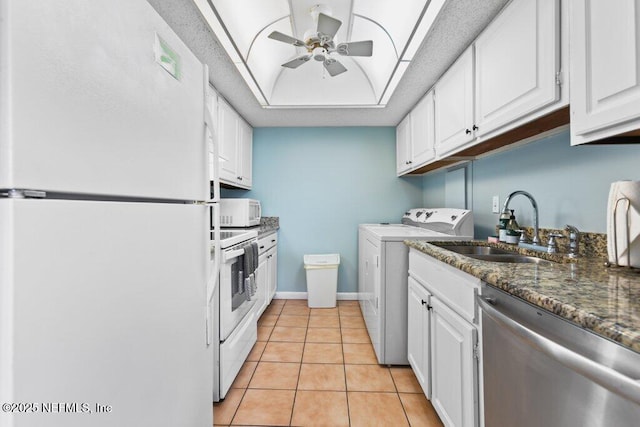 kitchen featuring white cabinets, white appliances, a sink, and ceiling fan