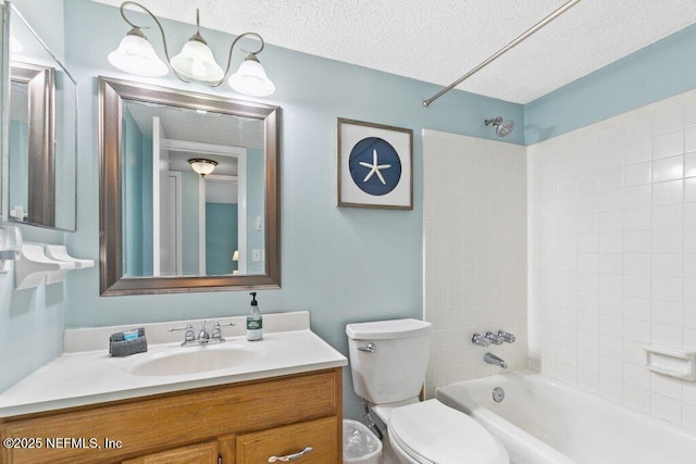 bathroom featuring a textured ceiling, toilet, vanity, and bathtub / shower combination