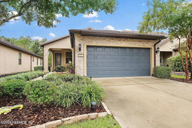 ranch-style home featuring a garage