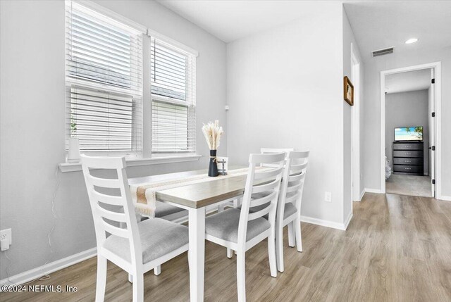 dining area featuring light wood-type flooring