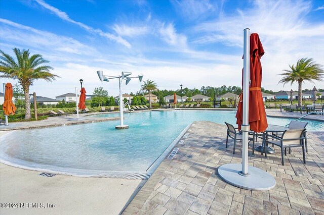 view of pool featuring a patio and pool water feature