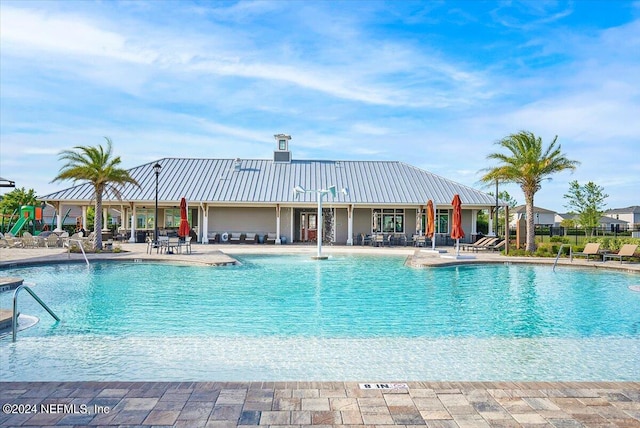 view of swimming pool with a patio area