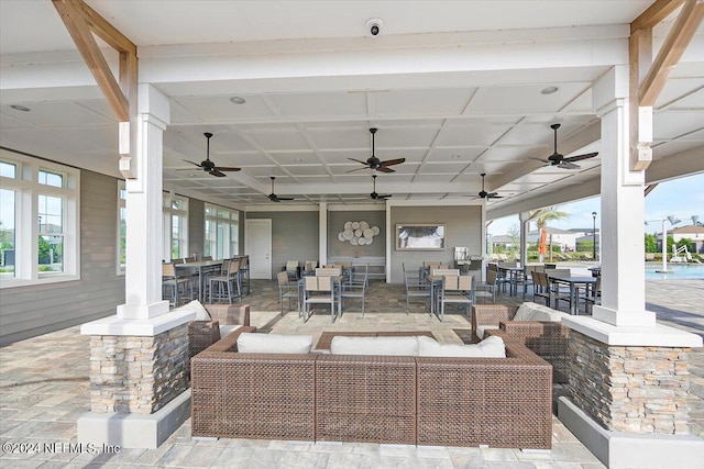 view of patio with ceiling fan and outdoor lounge area