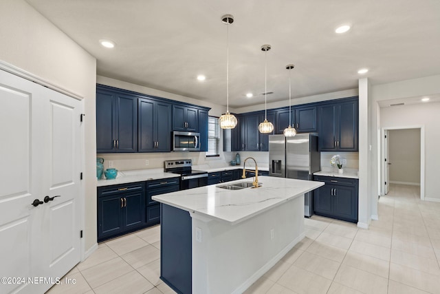 kitchen with blue cabinets, sink, light stone counters, stainless steel appliances, and a center island with sink