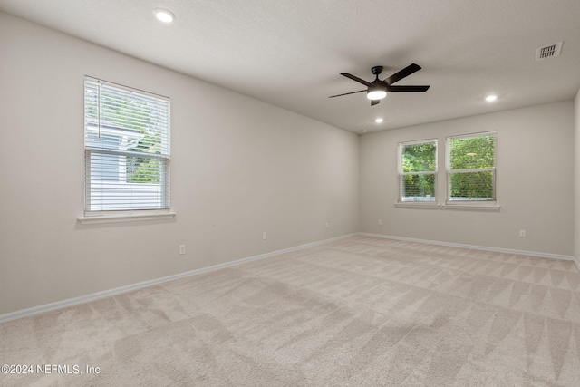 carpeted empty room with ceiling fan