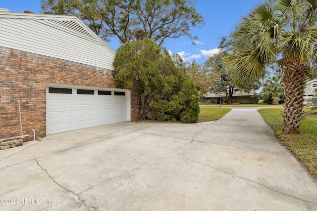 garage with a lawn