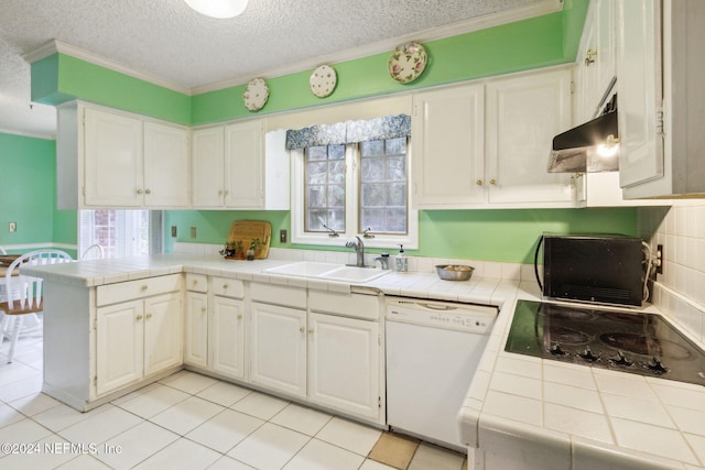 kitchen with white dishwasher, white cabinetry, extractor fan, and tile countertops