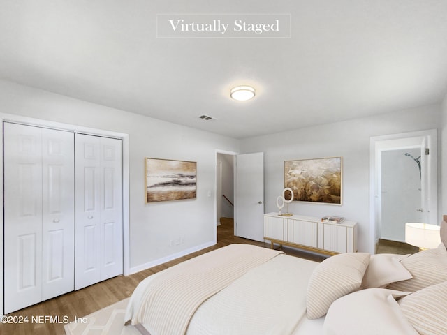 bedroom featuring a closet and hardwood / wood-style flooring