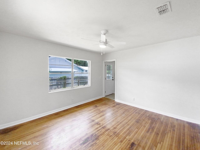 unfurnished room featuring hardwood / wood-style flooring and ceiling fan