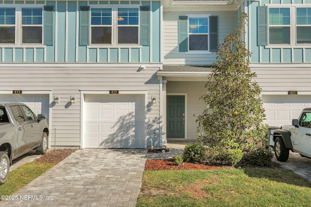 view of front of home with a garage and board and batten siding