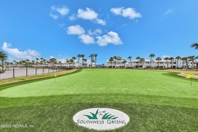 view of community featuring a residential view and fence