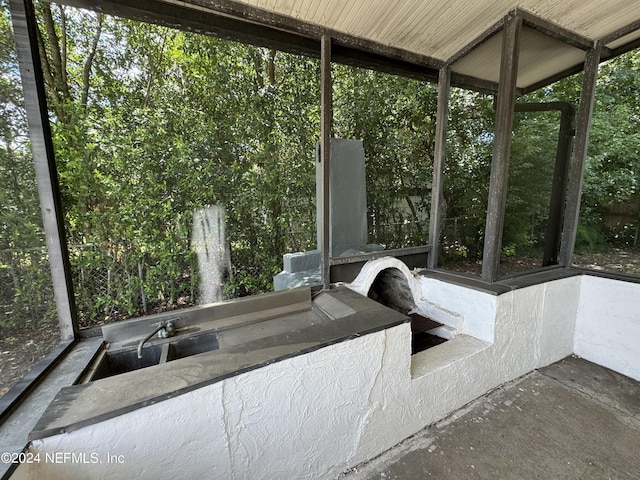 unfurnished sunroom featuring sink