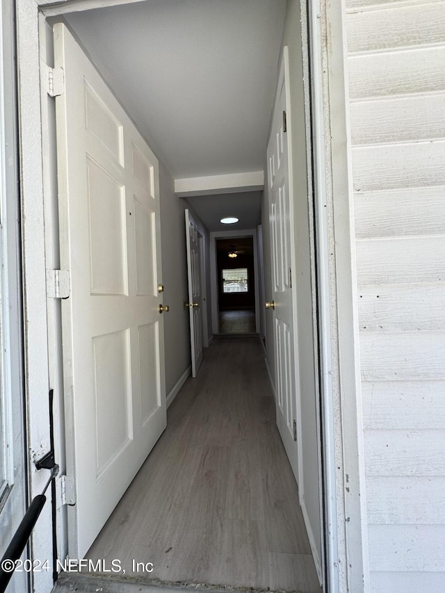 hallway featuring wood-type flooring