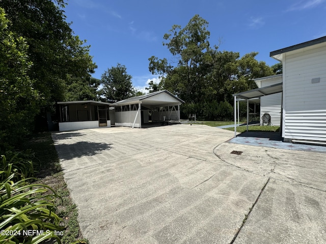 exterior space with a carport