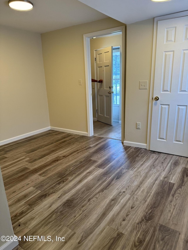 spare room with hardwood / wood-style flooring