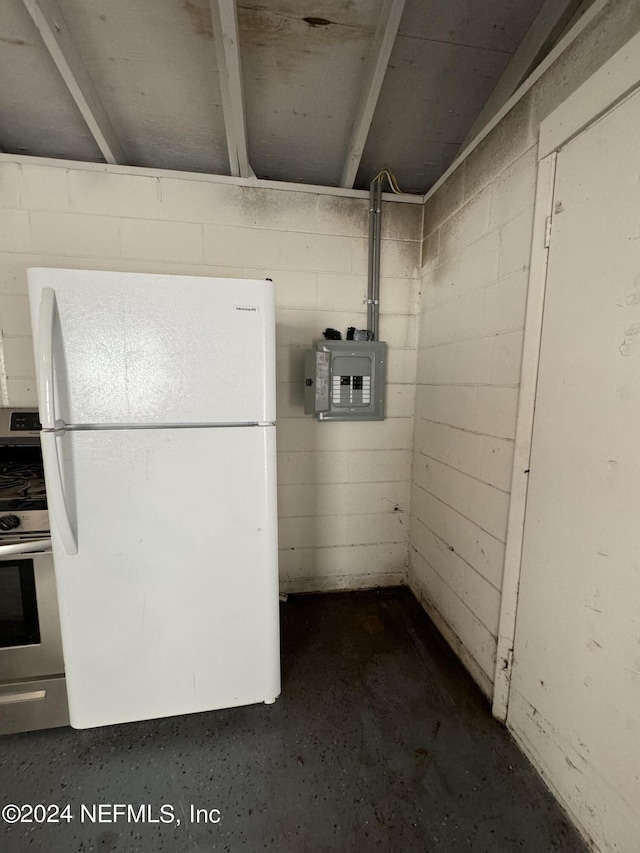 basement with electric panel and white fridge