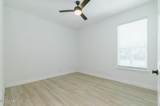 unfurnished room with ceiling fan and light hardwood / wood-style flooring