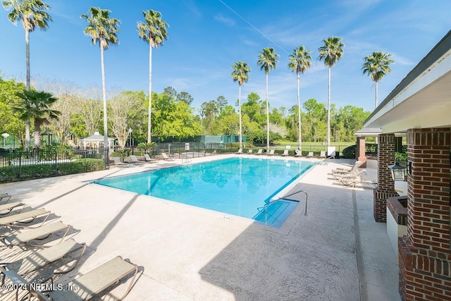 view of swimming pool with a patio area