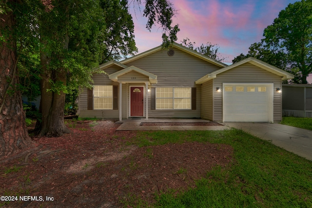 ranch-style house featuring a garage