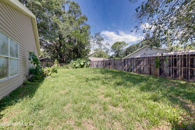 view of yard featuring fence