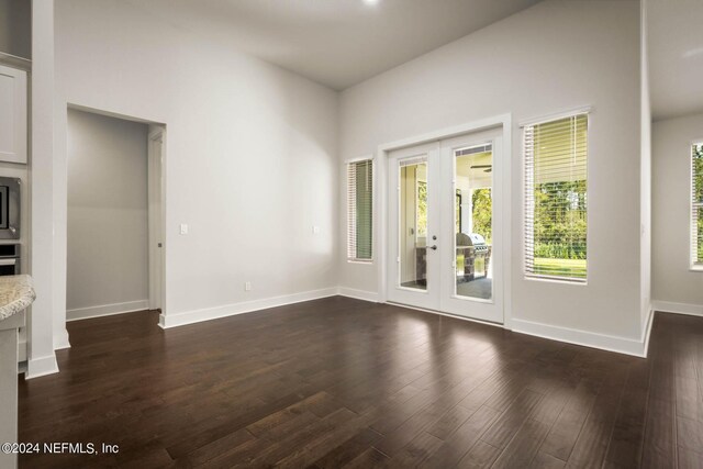 36247 Pitch Ln, Hilliard, FL 32046 - interior space featuring french doors, dark wood finished floors, and baseboards