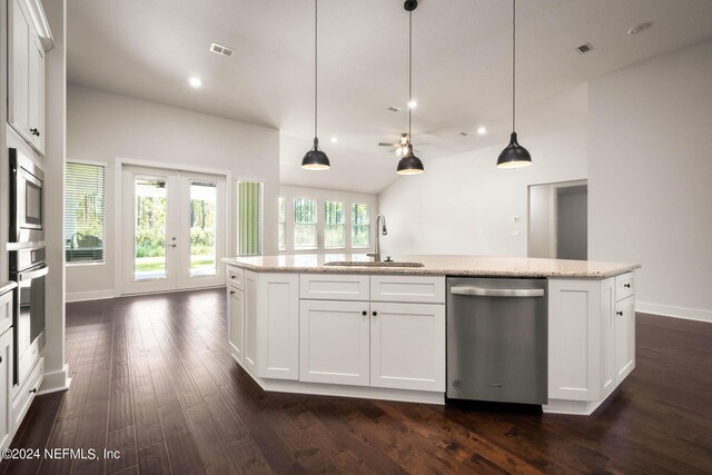 36247 Pitch Ln, Hilliard, FL 32046 - kitchen with a sink, white cabinets, french doors, appliances with stainless steel finishes, and dark wood-style floors
