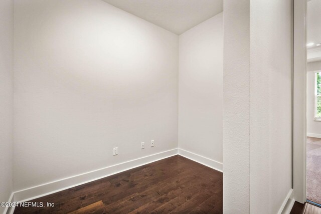 36247 Pitch Ln, Hilliard, FL 32046 - spare room featuring dark wood-style floors and baseboards