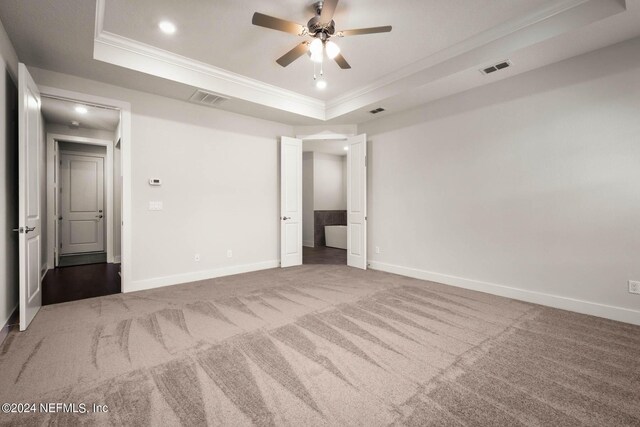 36247 Pitch Ln, Hilliard, FL 32046 - spare room with ornamental molding, a tray ceiling, visible vents, and carpet flooring