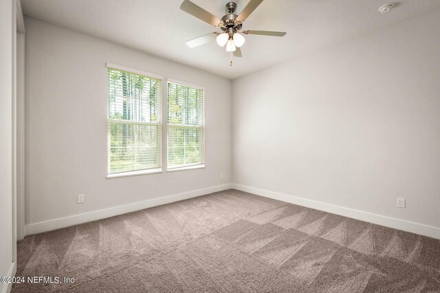 36247 Pitch Ln, Hilliard, FL 32046 - empty room featuring carpet flooring, a ceiling fan, and baseboards
