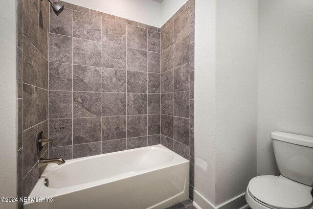 36247 Pitch Ln, Hilliard, FL 32046 - bathroom with baseboards, toilet, and shower / bathtub combination