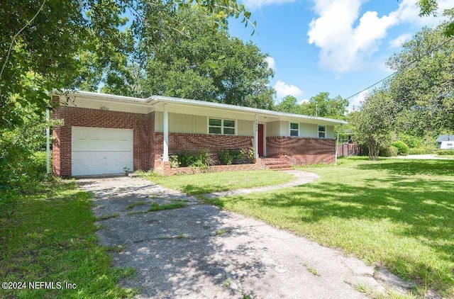 single story home featuring a garage and a front yard