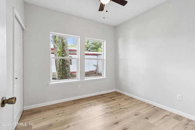 unfurnished bedroom featuring ceiling fan and light hardwood / wood-style flooring