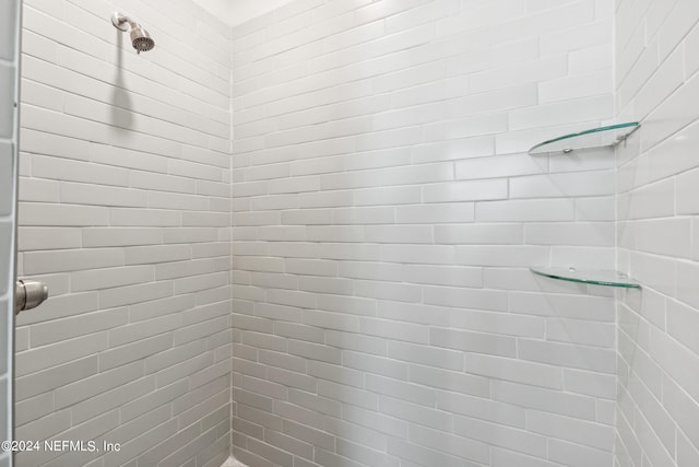 bathroom with a tile shower