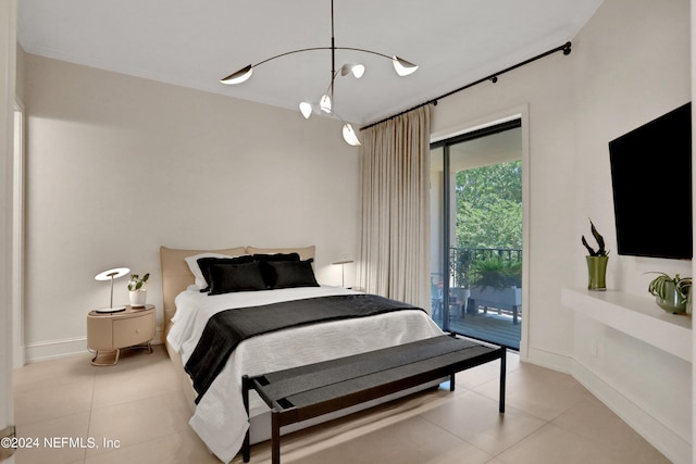 bedroom with access to exterior and light tile patterned floors