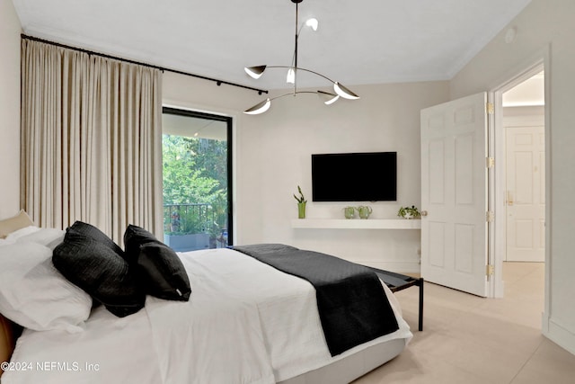 bedroom featuring a notable chandelier