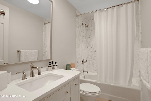 full bathroom featuring vanity, shower / bath combination with curtain, and toilet