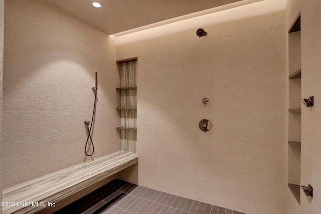 bathroom with tile patterned flooring and a shower