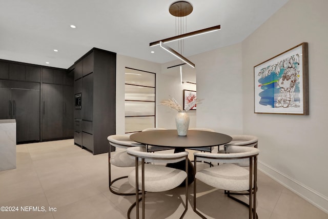 dining area featuring light tile patterned flooring