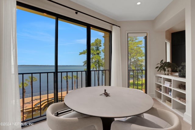 dining space featuring a water view