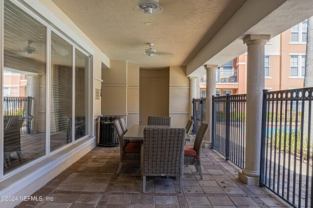 balcony featuring ceiling fan