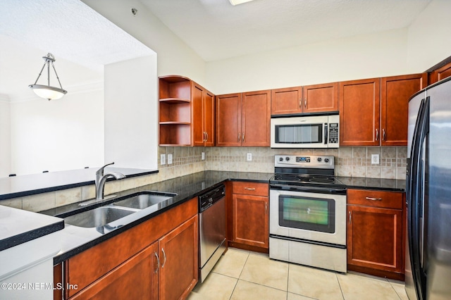 kitchen featuring stainless steel appliances, open shelves, a sink, and decorative backsplash