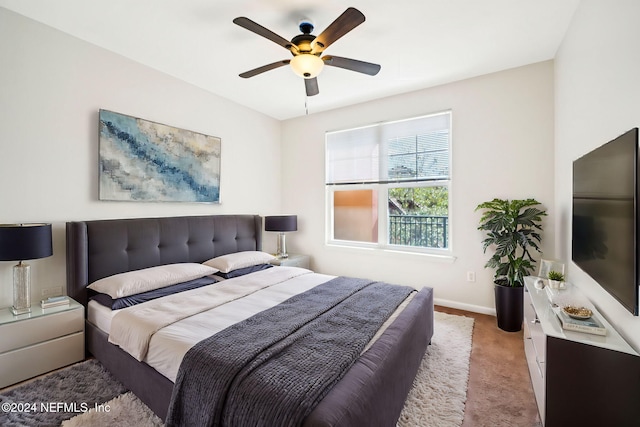 bedroom featuring ceiling fan, carpet floors, and baseboards