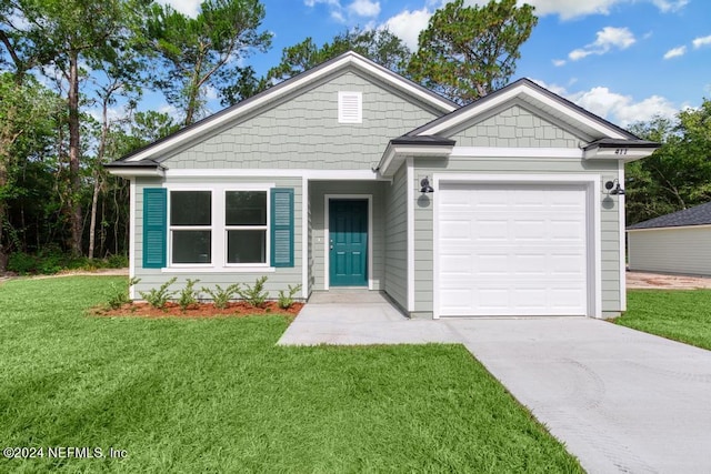 view of front of house with a garage, concrete driveway, and a front lawn