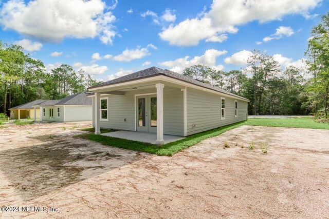 view of home's exterior featuring a patio area and a yard