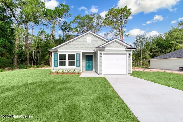 view of front of house featuring a garage and a front yard