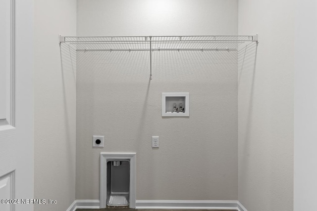 washroom with hookup for a washing machine, hookup for an electric dryer, and baseboards