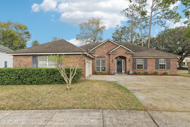 ranch-style house with a garage, brick siding, driveway, roof with shingles, and a front lawn